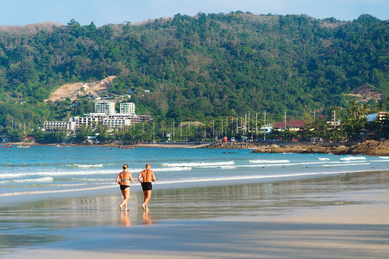 Couple running on the beach